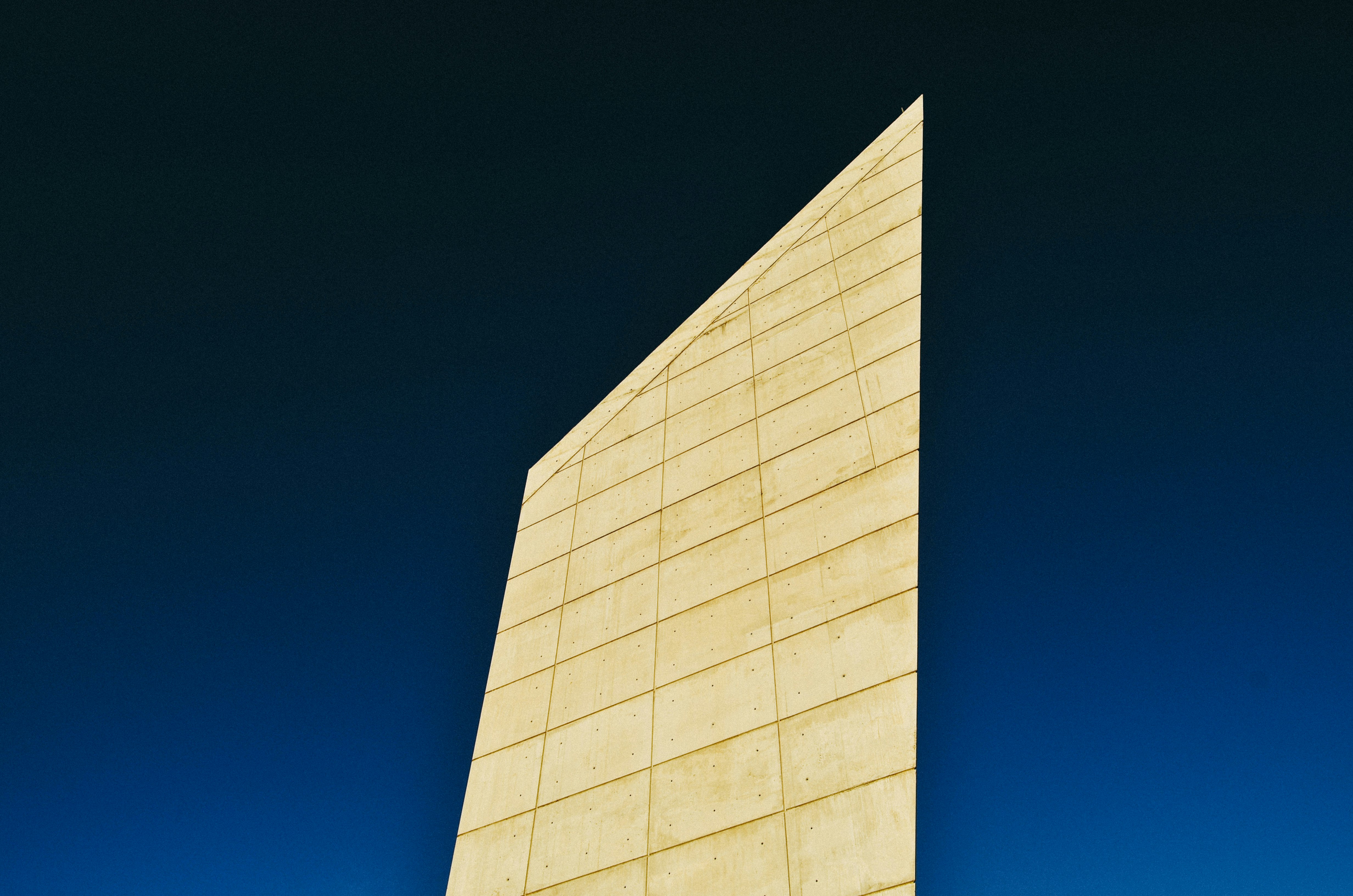 white concrete building under blue sky during daytime